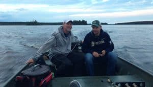 2 men on a boat in a lake in Milwaukee