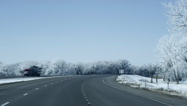 Open asphalt road in winter