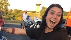 Woman smiling at motorcycle event