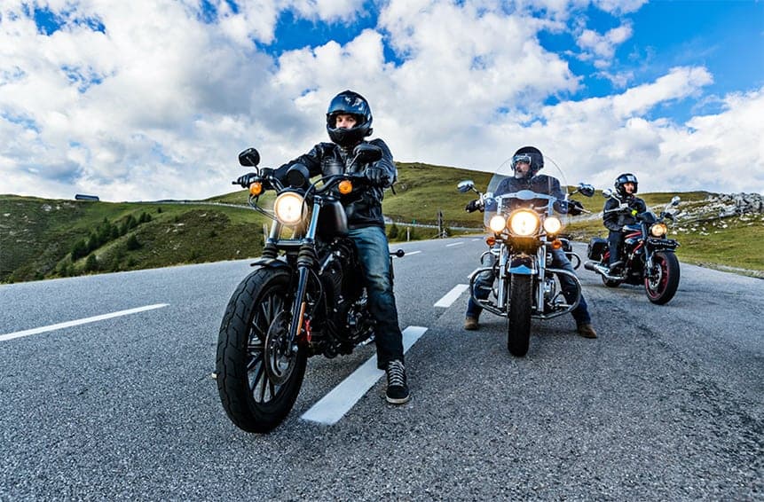 3 men riding motorcycles