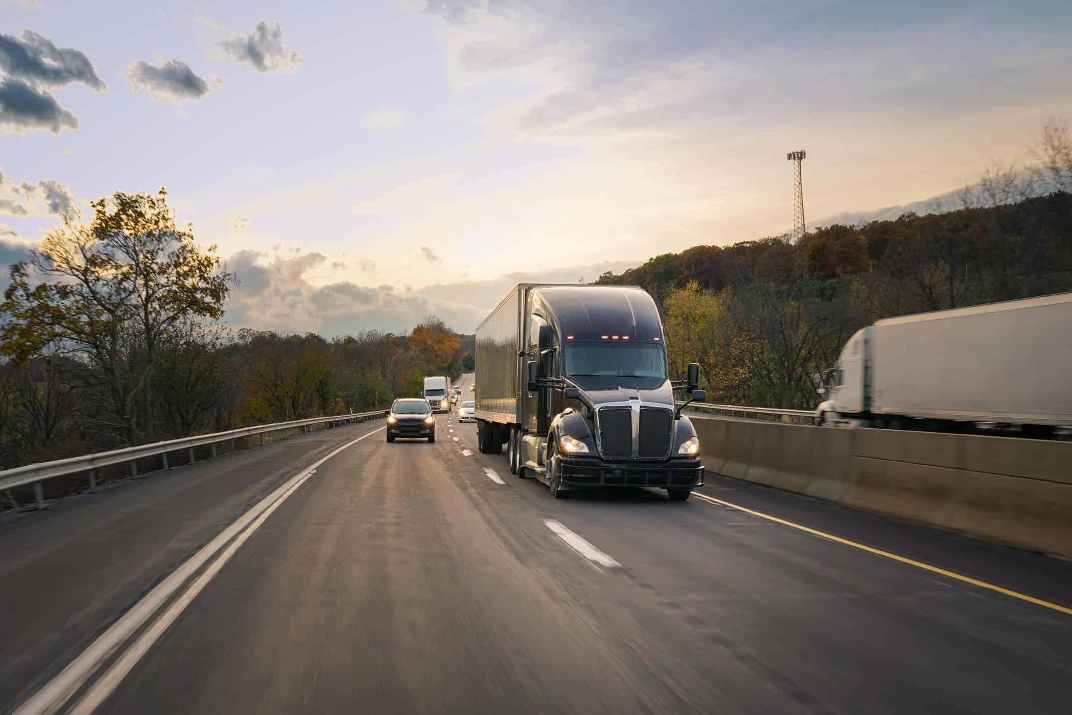 18 wheeler truck driving down road