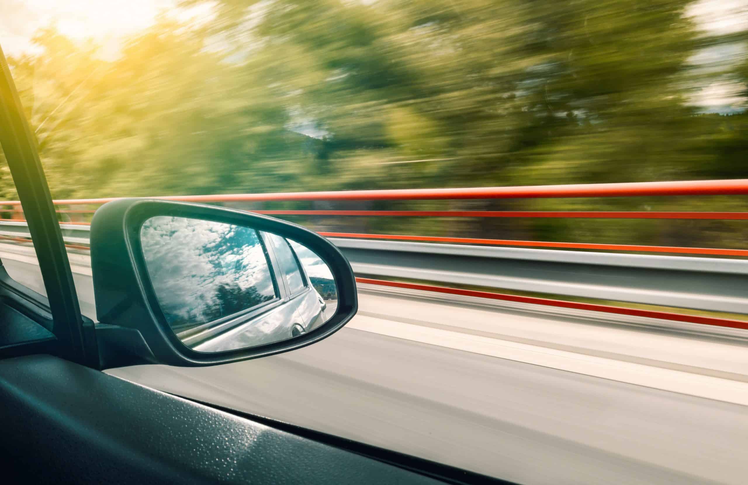 blurry window of car driving