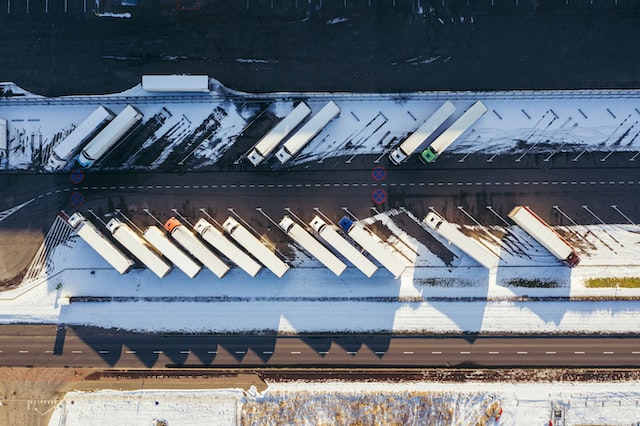 truck loading warehouse as seen from above during winter